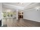 Bright, open living space with a fireplace and access to the dining area and kitchen at 210 Arbor Creek Dr, Dallas, GA 30157