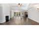 Spacious living area with a fireplace and an open floor plan to the dining area at 210 Arbor Creek Dr, Dallas, GA 30157