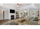 Bright, open living space features a fireplace and view into the dining area at 210 Arbor Creek Dr, Dallas, GA 30157