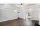 Spacious open-concept living space with a fireplace, ceiling fan, and wood-look flooring at 210 Arbor Creek Dr, Dallas, GA 30157