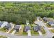 Beautiful aerial view of a two-story home with a lush green tree line in the background at 6904 Estepona St, Atlanta, GA 30349