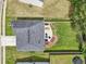 Overhead view of a home's roof and backyard patio area with outdoor furniture at 6904 Estepona St, Atlanta, GA 30349