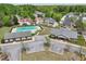 Aerial shot of a community pool and clubhouse surrounded by mature trees and residential homes at 6904 Estepona St, Atlanta, GA 30349