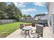 Backyard patio offers cozy seating and a lush green lawn at 6904 Estepona St, Atlanta, GA 30349