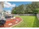 Spacious backyard with a well-maintained lawn and a patio at 6904 Estepona St, Atlanta, GA 30349