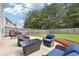 Backyard patio offers cozy seating, perfect for outdoor relaxation at 6904 Estepona St, Atlanta, GA 30349