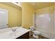 Inviting bathroom features a sink, toilet, and bathtub/shower, offering functionality in a compact space at 6904 Estepona St, Atlanta, GA 30349