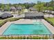 Outdoor community pool with an adjacent building and a partially drained shallow end at 6904 Estepona St, Atlanta, GA 30349
