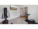 Exercise room equipped with workout equipment and a modern flat-screen TV for entertainment at 6904 Estepona St, Atlanta, GA 30349