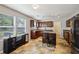 Well-lit kitchen with warm wood cabinets, stainless steel appliances, and a center island at 6904 Estepona St, Atlanta, GA 30349