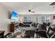 Inviting living room area with plush seating, modern ceiling fan, and fireplace at 6904 Estepona St, Atlanta, GA 30349