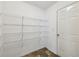 Walk-in pantry with white shelves and door, ideal for storing kitchen essentials at 6904 Estepona St, Atlanta, GA 30349