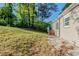 The grassy backyard shows potential for landscape design with its yard and access to the home at 2910 Diana Sw Dr, Atlanta, GA 30315