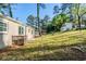Spacious backyard with lush greenery and charming outbuilding, perfect for outdoor enjoyment at 2910 Diana Sw Dr, Atlanta, GA 30315