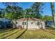 Back of house with grassy yard and mature trees at 2910 Diana Sw Dr, Atlanta, GA 30315