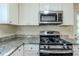 Close up of the modern kitchen featuring stainless steel appliances and granite countertops at 2910 Diana Sw Dr, Atlanta, GA 30315