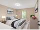 Relaxing bedroom featuring a comfortable queen-size bed and a neutral color scheme at 113 Fowler Dr, Bowdon, GA 30108