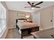 Bedroom with ceiling fan, closet and a window for natural light at 113 Fowler Dr, Bowdon, GA 30108