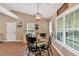 Dining area featuring a modern chandelier and views of the backyard at 113 Fowler Dr, Bowdon, GA 30108