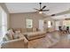 A spacious living room and dining area featuring a high ceiling, neutral walls, and lots of windows at 113 Fowler Dr, Bowdon, GA 30108