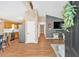 Inviting living room with hardwood floors and vaulted ceilings offering a seamless flow to the kitchen at 113 Fowler Dr, Bowdon, GA 30108