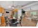 Open-concept living space with kitchen, dining area, and living room featuring wood flooring at 113 Fowler Dr, Bowdon, GA 30108