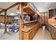 Finished basement features a stone fireplace, bar and prep area, creating a cozy and functional entertaining space at 135 Longview Rd, Fayetteville, GA 30214