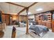 Spacious finished basement features natural light, wooden beams, a decorative fireplace, and ample storage at 135 Longview Rd, Fayetteville, GA 30214