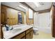 Bathroom features a single sink vanity, mirror, and full shower-tub combo, providing functionality at 135 Longview Rd, Fayetteville, GA 30214
