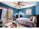 Comfortable bedroom featuring exterior doors and a vintage lamp at 135 Longview Rd, Fayetteville, GA 30214