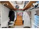 Walk-in closet featuring wood shelving, hanging storage, and a small dresser at 135 Longview Rd, Fayetteville, GA 30214