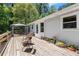 Relaxing wooden deck featuring outdoor seating and a gazebo perfect for entertaining and enjoying the natural surroundings at 135 Longview Rd, Fayetteville, GA 30214
