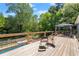 Spacious deck overlooking the backyard and pool area, ideal for outdoor gatherings and enjoying the view at 135 Longview Rd, Fayetteville, GA 30214