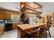 Kitchen featuring butcher block island with wooden cabinets and black appliances at 135 Longview Rd, Fayetteville, GA 30214