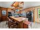 Kitchen featuring wooden cabinets and butcher block island with seating at 135 Longview Rd, Fayetteville, GA 30214