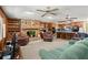 Open concept living room featuring built in bookcase and fireplace at 135 Longview Rd, Fayetteville, GA 30214