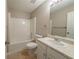 Clean bathroom with a shower-tub combo, neutral-colored vanity and matching fixtures at 1401 Kala Dr, Lithonia, GA 30058
