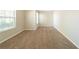 Empty bedroom with neutral walls and carpet, featuring two windows at 1401 Kala Dr, Lithonia, GA 30058