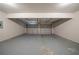 Spacious two-car garage with a clean painted floor and white walls at 1401 Kala Dr, Lithonia, GA 30058