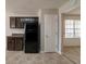 Bright kitchen showcasing ample storage space, brown cabinetry, and contemporary tile flooring at 1401 Kala Dr, Lithonia, GA 30058