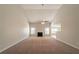 Spacious living room with a fireplace, large windows, and vaulted ceiling at 1401 Kala Dr, Lithonia, GA 30058