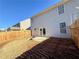 Fenced backyard showcasing a patio with a stone fire pit near the home at 3723 Verde Glen Ln, Cumming, GA 30040