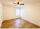 Bright bedroom with wood floors, ceiling fan, and a window at 3723 Verde Glen Ln, Cumming, GA 30040