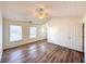 Bright bedroom with ceiling fan, two windows and easy access to the ensuite bathroom at 3723 Verde Glen Ln, Cumming, GA 30040