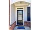 Classic front door with glass panels and decorative molding, framed by gray siding at 3723 Verde Glen Ln, Cumming, GA 30040