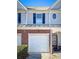 Townhouse with brick accents, a single-car garage, and a welcoming front door at 3723 Verde Glen Ln, Cumming, GA 30040