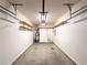 Well lit garage provides storage shelves, garage door and access to the home at 3723 Verde Glen Ln, Cumming, GA 30040