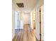 Inviting hallway with neutral walls, modern floors, and easy access to other rooms at 3723 Verde Glen Ln, Cumming, GA 30040
