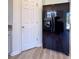 The kitchen has stainless steel refrigerator and door to a closet at 3723 Verde Glen Ln, Cumming, GA 30040