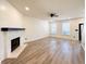 Inviting living room featuring a fireplace, wood flooring, and abundant natural light at 3723 Verde Glen Ln, Cumming, GA 30040